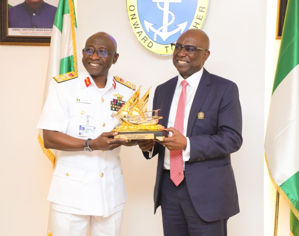 DG NIMASA, Dr Dayo Mobereola and the Chief of the Naval Staff, Vice Admiral Idi Abbass exchanging souvenirs during the NIMASA/NAVY MOU Signing Ceremony at the Naval HQ in Abuja.